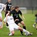 Dexter junior Bethany Shiguango tries to score as Huron senior Maggie Hannaford defends on Tuesday, April 23. Daniel Brenner I AnnArbor.com